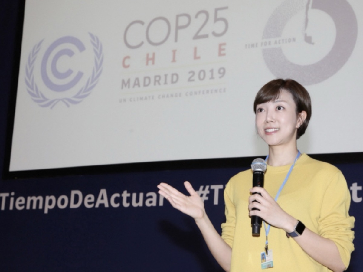 Youree Lee speaking on stage at COP25 in Madrid